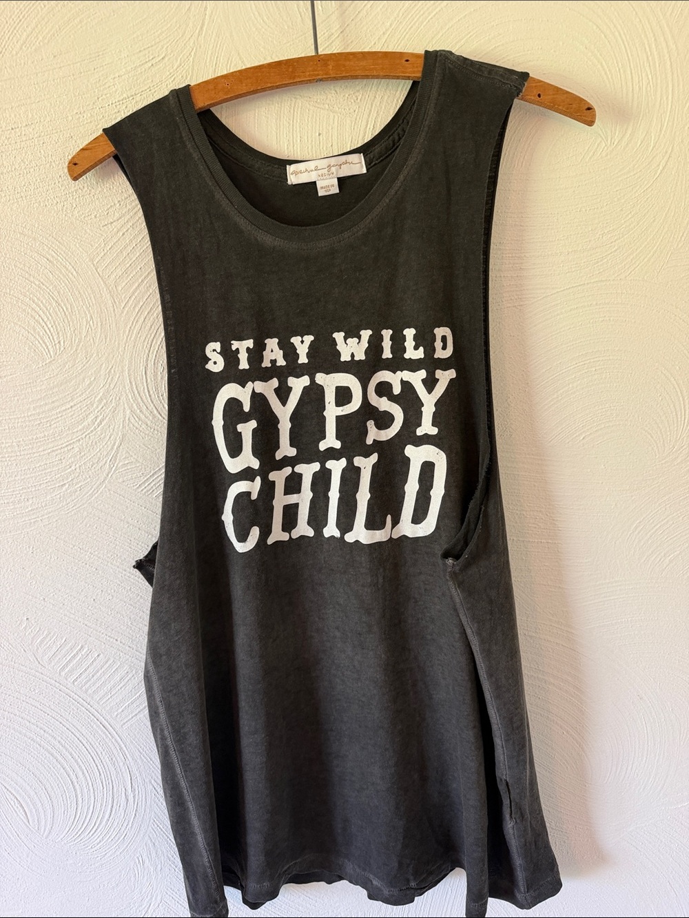 Spiritual Gangster Black Muscle Tank with White "Stay Wild Gypsy Child" Graphic.